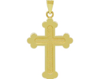 May include: A gold-colored cross pendant with a textured surface. The cross has a simple, elegant design with rounded edges.