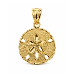 May include: A gold pendant shaped like a sand dollar, featuring a textured surface and a central five-petal star design. The circular piece includes five small cutouts along the perimeter and a polished gold bail at the top for hanging.