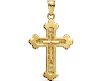 May include: A gold cross pendant featuring a layered design with a textured, stippled finish on the inner cross and smooth, polished edges. The cross has rounded, trefoil-style ends and includes a polished gold bail at the top for hanging.