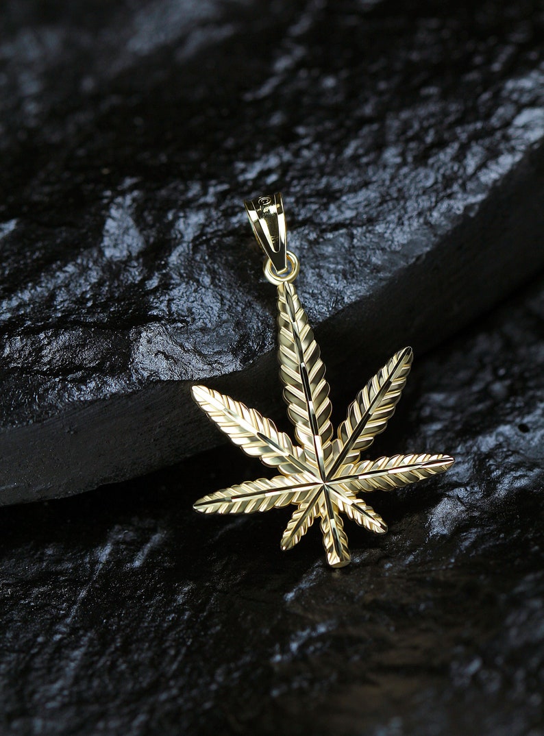 Gold Marijuana Leaf pendant made with 10 karat yellow gold