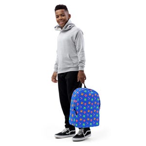 Sac à dos pour enfant à imprimé monstres colorés | Cartable amusant et ludique pour les petits aventuriers | Sac à dos monstre