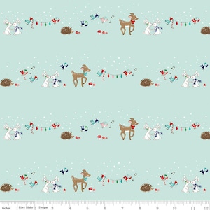 May include: A light blue fabric with a repeating pattern of cartoon animals and holiday elements. The design includes deer, rabbits, hedgehogs, birds, and string lights, with snowflakes scattered across the background. The fabric is measured in inches.