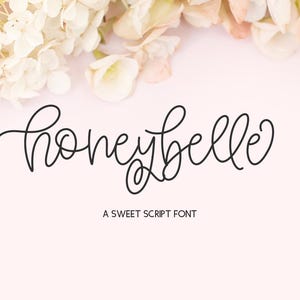 May include: A handwritten font called "Honeybelle" in black script on a light pink background with white flowers at the top. The text below the font says "A Sweet Script Font".