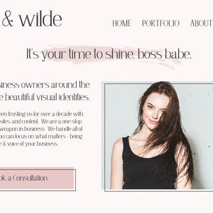 May include: Website homepage for a business called "hope & wilde" that helps business owners create visual identities. The text "It's your time to shine, boss babe." is displayed in a pink brushstroke. A woman with long brown hair is pictured in the background.