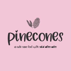 May include: A digital graphic on a light pink background featuring the dark gray text "pinecones" with a small heart above the letter i. Above the text are illustrations of a pinecone and a pine needle. Below is the text "a cute sans font with solid alternates".