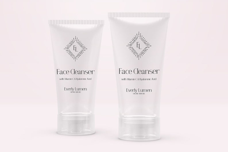 May include: Two white tubes of face cleanser with a black and white logo and text that reads "Face Cleanser with Vitamin C & Hyaluronic Acid Everly Lumen".