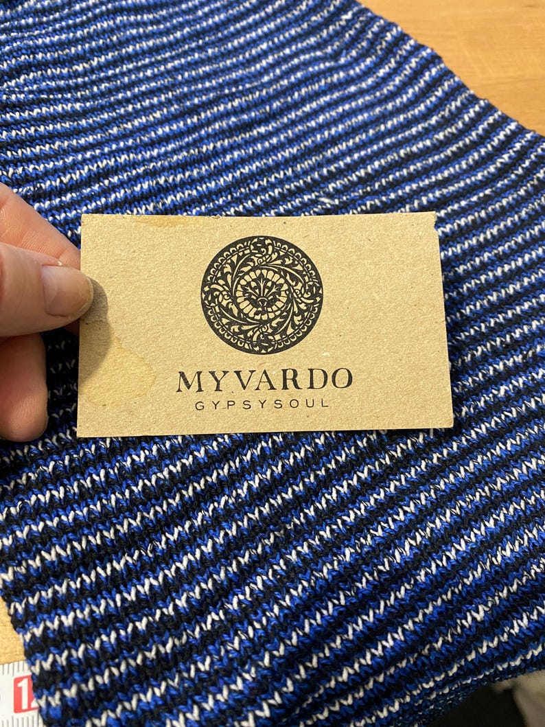 May include: A brown card with a black circular design and the text "MYVARDO GYPSYSOUL".