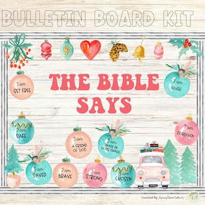 May include: A bulletin board kit with a wooden background. The text "THE BIBLE SAYS" is in pink. The kit includes ornaments with phrases like "I am loved" and "I am safe", along with a pink car and Christmas tree illustrations.