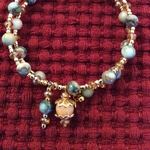Green Marble Bead, Gold Crystal and Gold Tone Bead Bracelet with Handmade Charms
