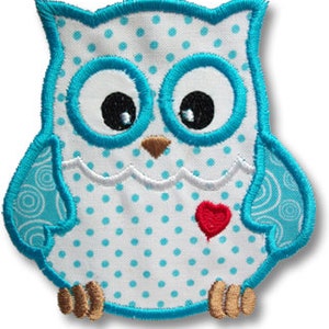 May include: A blue and white owl applique with a red heart. The owl has a white body with blue polka dots and a blue outline. The heart is in the center of the owl's chest.
