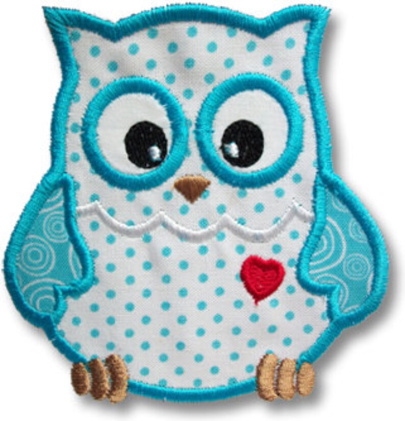 May include: A blue and white owl applique with a red heart. The owl has a white body with blue polka dots and a blue outline. The heart is in the center of the owl's chest.