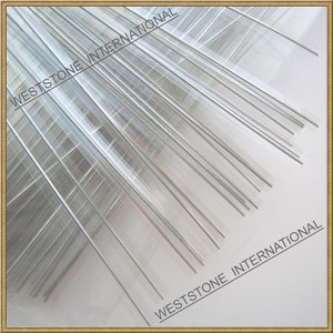 May include: A close-up of a bundle of clear plastic tubes with silver wire inside. The tubes are arranged in a fan shape and the text "WESTSTONE INTERNATIONAL" is visible at the top and bottom of the image.