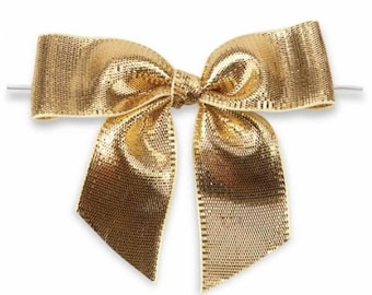 May include: A gold metallic bow with a wire loop for attaching to gifts or packages.
