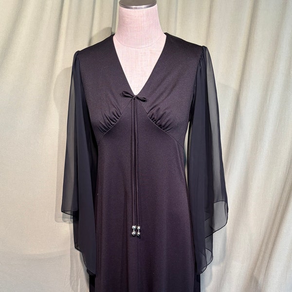 Charmante robe maxi originale vintage des années 70 en polyester noir avec manches papillon transparentes buste 34 taille empire 30