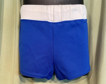 May include: Blue athletic shorts with a white elastic waistband.