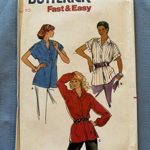 May include: Vintage sewing pattern for a women's blouse with three different styles. The pattern is from Butterick and is labelled "Quick! Fast & Easy" and "6888".