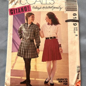 May include: A vintage McCall's sewing pattern for a skirt and jacket. The pattern is for size 8 and features a plaid skirt and a black and white plaid jacket. The pattern is titled "Gitano" and includes the text "today's spirited family".