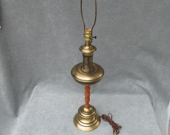 Brass plated or brass look tall lamp Vintage fancy pierced design spindled wood electric table lamp with antique brass or gold tone finish