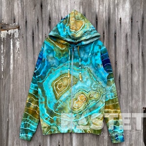 May include: A blue, green and yellow tie-dye zip-up hoodie with a hood. The hoodie has a swirling pattern.