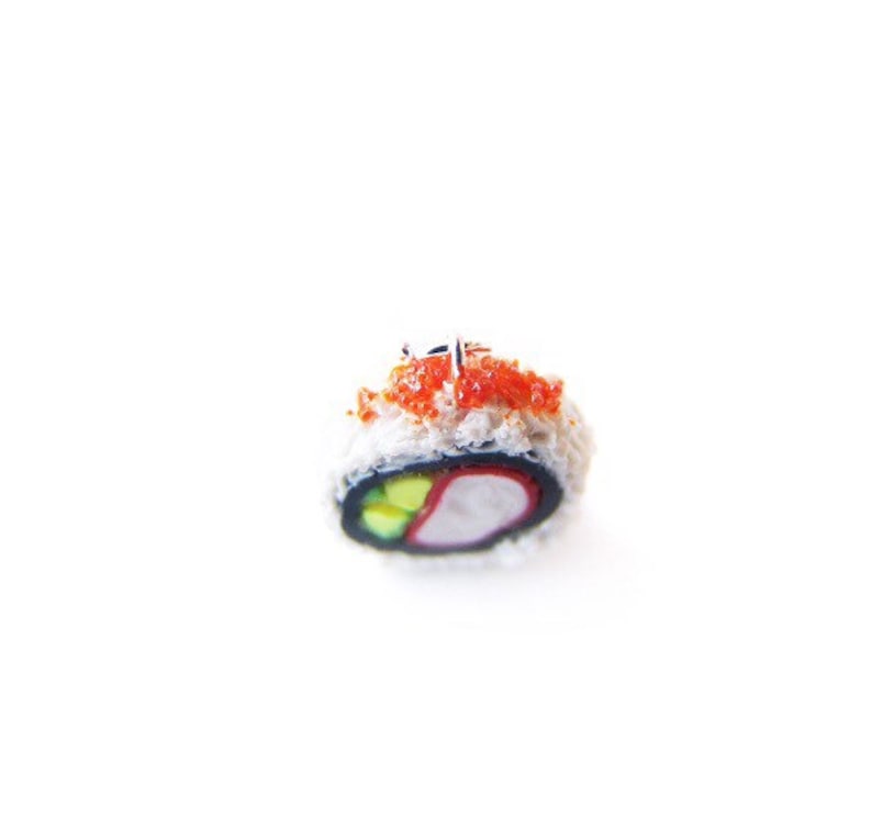 May include: A single piece of sushi with a red and white filling, topped with red tobiko and wrapped in seaweed.