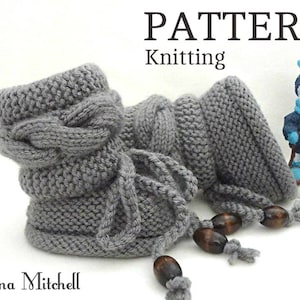 May include: Knitting pattern for a pair of gray knitted baby booties with a cable knit design and brown wooden toggles. The pattern is titled "PATTERN Knitting".