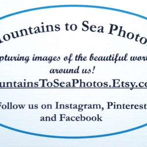 May include: Blue oval logo with the text "Mountains to Sea Photos" in a white circle. The text "Capturing images of the beautiful world around us!" is below the logo. The text "MountainsToSeaPhotos.Etsy.com" is below the text. The text "Follow us on Instagram, Pinterest and Facebook" is below the website address.
