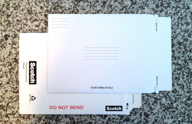 May include: White envelope with a Scotch logo and the text "Do Not Bend or Fold". The envelope is made for photo or document mailing.