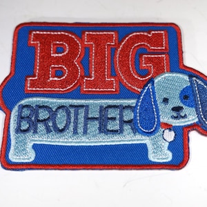 May include: Blue and red embroidered patch with a cartoon dog and the text "BIG BROTHER"