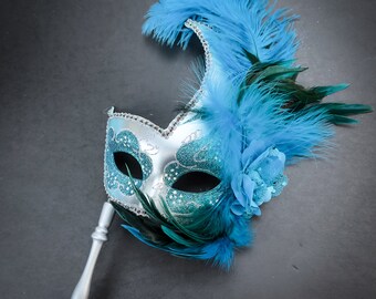 Holding stick masquerade mask with stick mint teal blue and silver