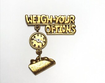 Weigh your options scale brooch by Danecraft