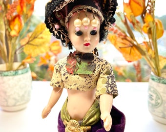 Vintage miniature oriental doll