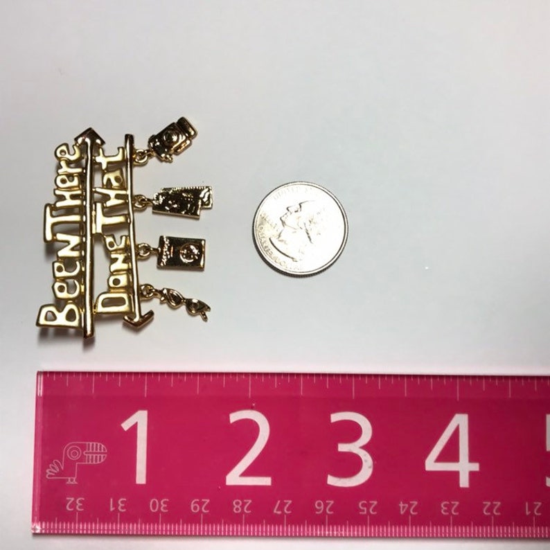 Been there done that brooch by Danecraft