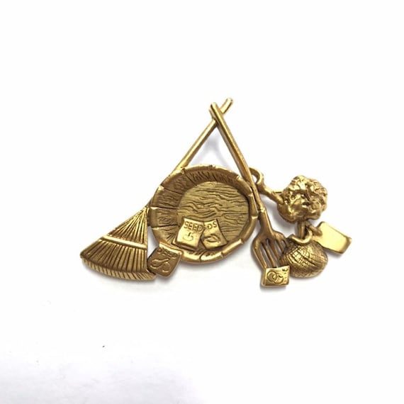 Seeds and Planting paraphernalia Brooch by Danecra
