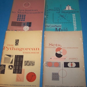 May include: Four vintage mathematics textbooks with colorful covers. Titles include "Invitation to Mathematics," "The World of Statistics," "The Pythagorean Theorem," and "Sets, Sentences, and Operations." The books feature diagrams and equations.