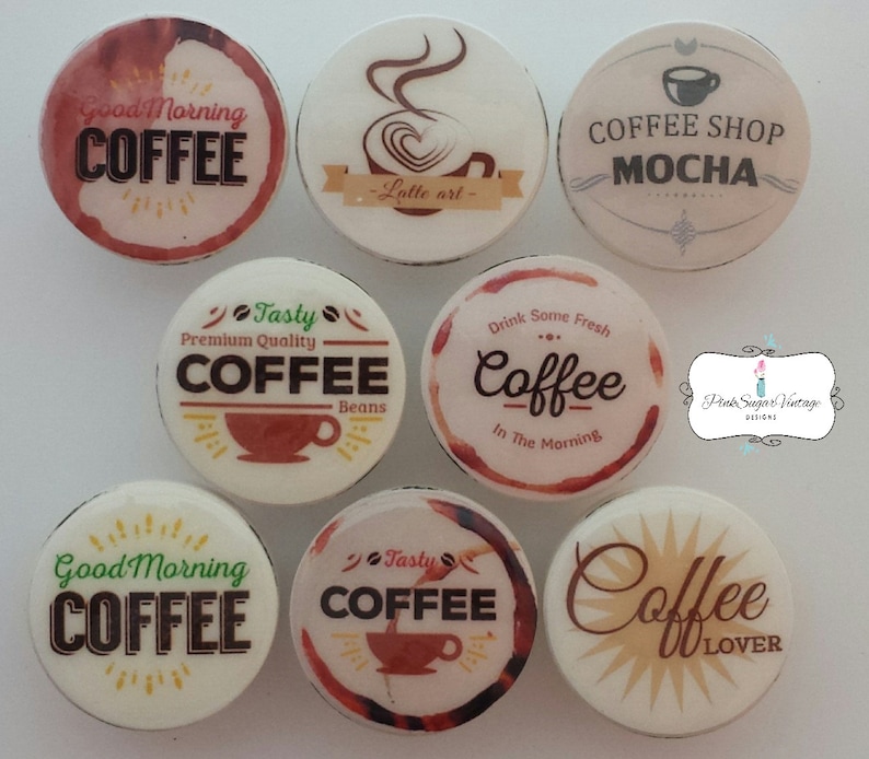 May include: Eight round ceramic coasters with coffee-themed designs. The coasters feature various coffee-related phrases and images, including "Good Morning Coffee", "Tasty Coffee", "Coffee Shop Mocha", "Drink Some Fresh Coffee", and "Coffee Lover".