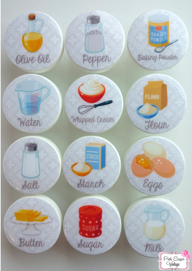 May include: Set of 12 white round kitchen cabinet knobs with colorful illustrations of baking ingredients, including olive oil, pepper, baking powder, water, whipped cream, flour, salt, starch, eggs, butter, sugar, and milk.