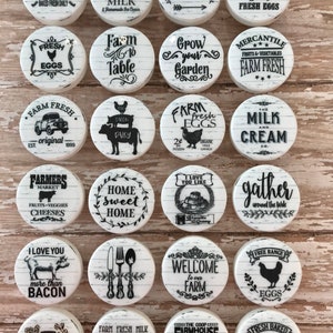 May include: A collection of 16 white round ceramic tiles with black and white farmhouse themed designs. The tiles feature various sayings and images, including "Farm Fresh", "Bakery", "Fresh Eggs", "Farm to Table", "Grow Your Garden", "Home Sweet Home", "Welcome to Our Farm", "The Coop Farmhouse", and "Fresh Baked Pies".