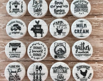 May include: A collection of 16 white round ceramic tiles with black and white farmhouse themed designs. The tiles feature various sayings and images, including "Farm Fresh", "Bakery", "Fresh Eggs", "Farm to Table", "Grow Your Garden", "Home Sweet Home", "Welcome to Our Farm", "The Coop Farmhouse", and "Fresh Baked Pies".