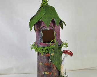 Purple Fairy House, 9" tall, sitting on a stump, tiny home for woodland fae folk, perched upon a mossy tree stump, twig ladder & mushroom