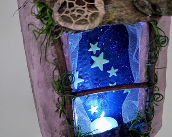 Fairy Window Box, 8" tall, trimmed with twigs, vines and moss. A small blue bird sits on the windowsill and looks out onto a starry night.