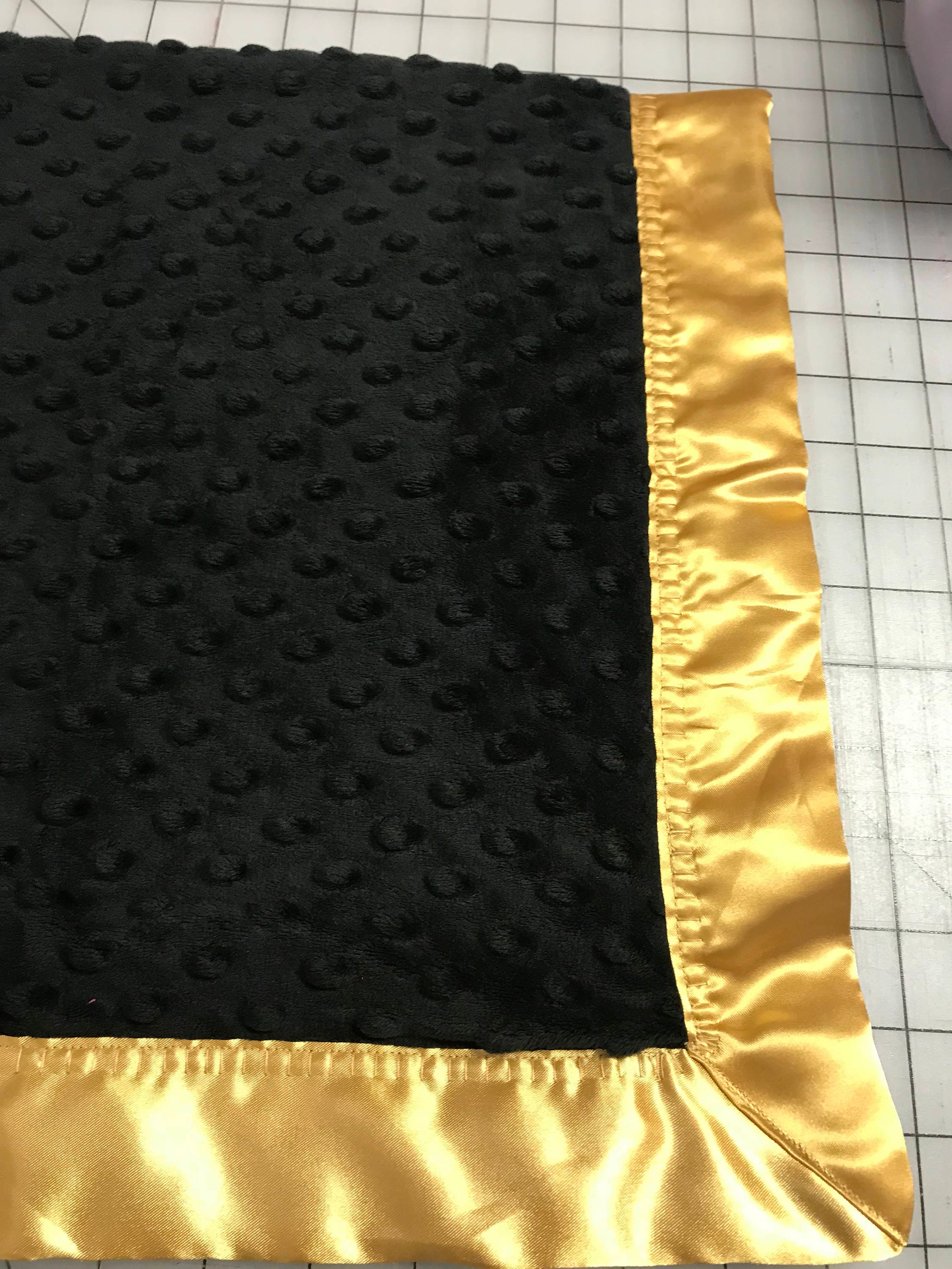 30 x 34 black and gold minky and satin baby blanket