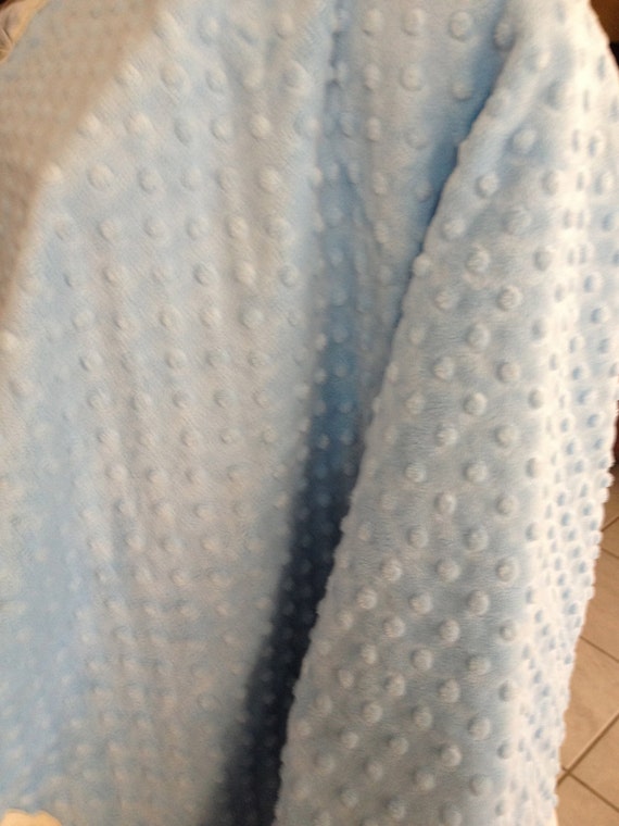 30 x 35 Ivory Minky dot baby blanket with ruffled edge and satin back.