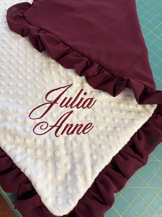 Upcycle bridesmaids or wedding dresses to create a custom baby minky and satin blanket.