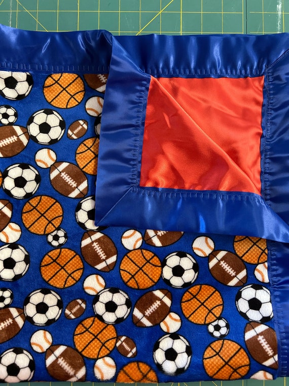 All sports 30 x 35 minky baby blanket with orange satin and royal binding and FREE embroidery