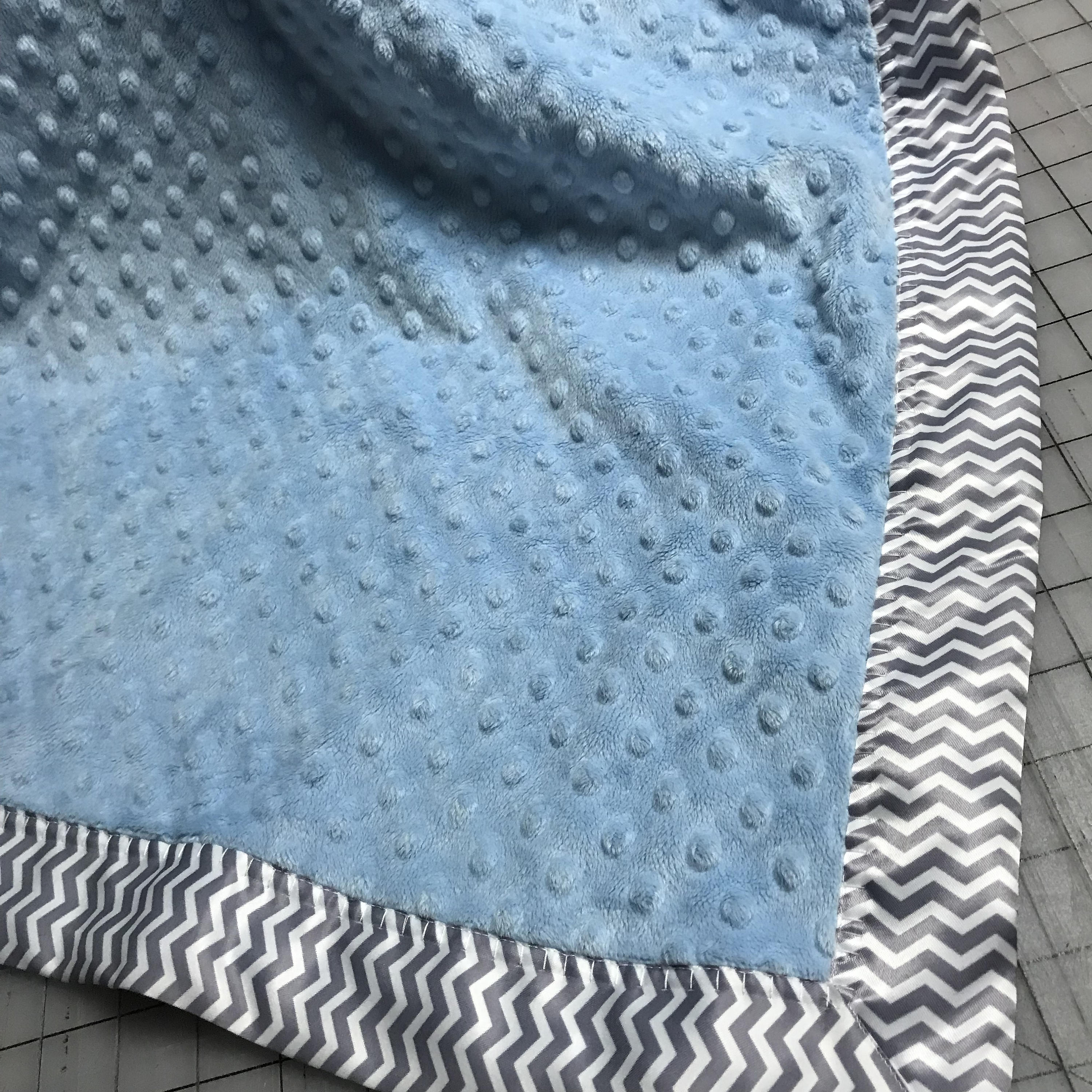 Blue minky dot baby blanket with gray satin backing and gray and