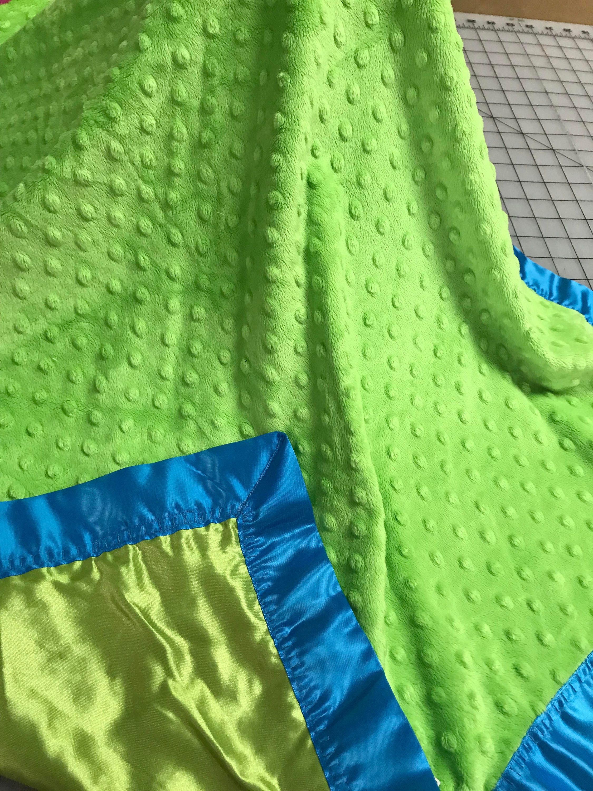 Lime minky dot and satin blanket with neon blue binding