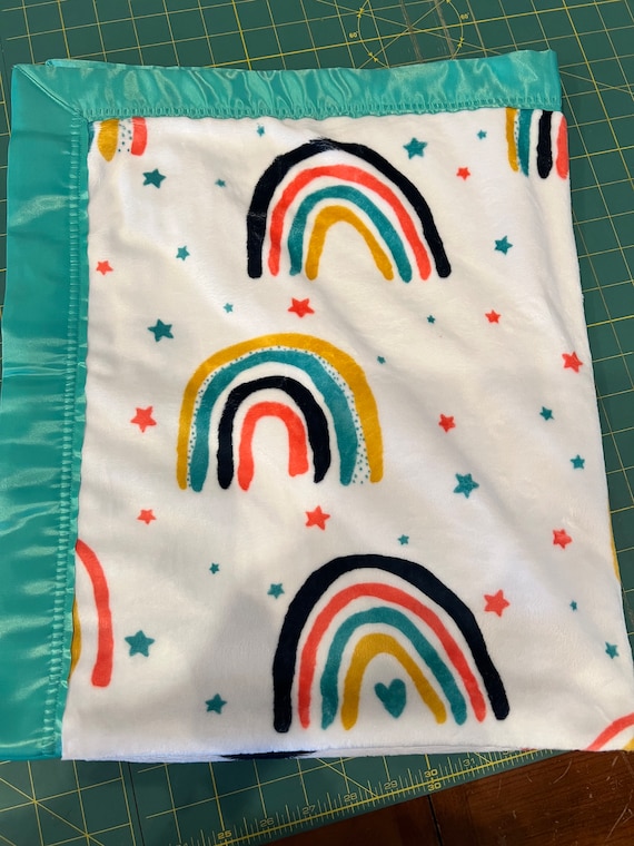 Double rainbow minky dot blanket with green satin binding