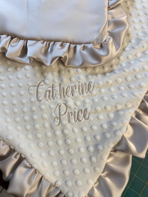 Upcycle bridesmaids or wedding dresses to create a  custom baby minky and satin blanket.