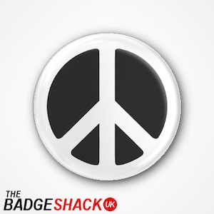 May include: White button with a black peace sign symbol.