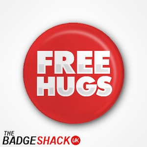 May include: Red round button with white text that says "FREE HUGS".